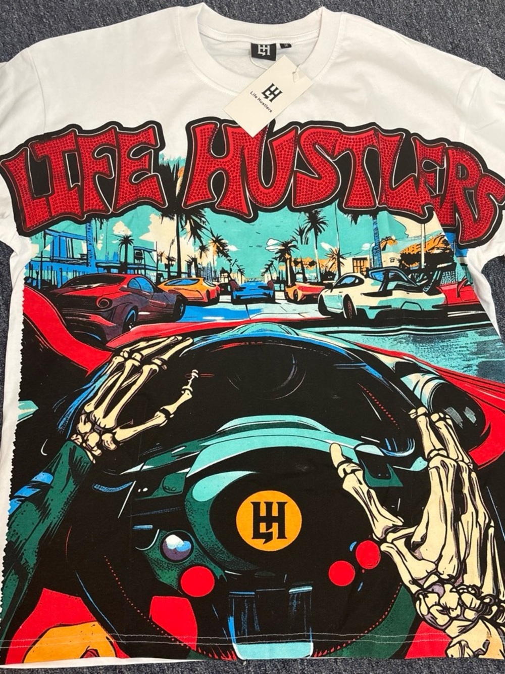Hustler Hollywood Men’s Graphic Tee — White with Red & Teal Street Print